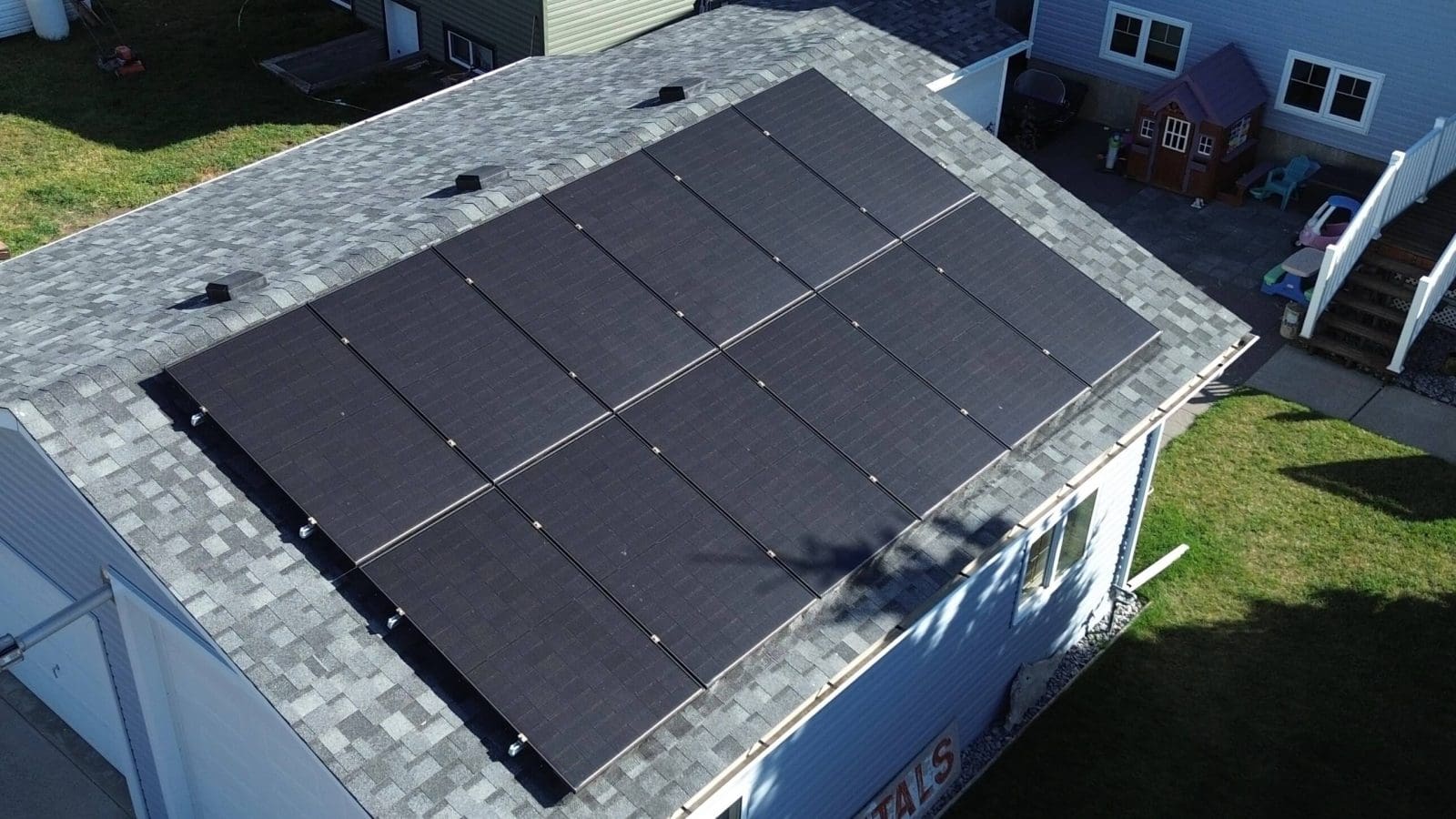 A garage with solar panels on the roof