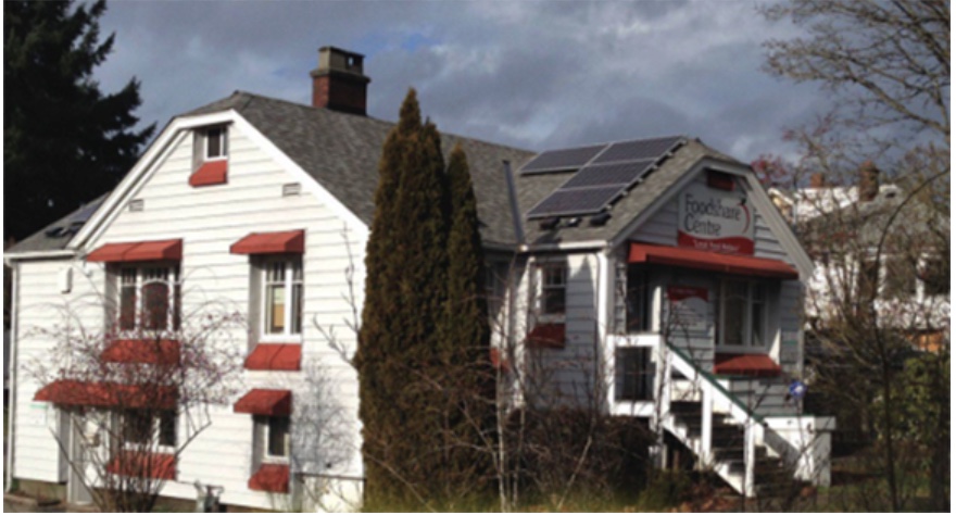 A community building with a solar array on the roof.