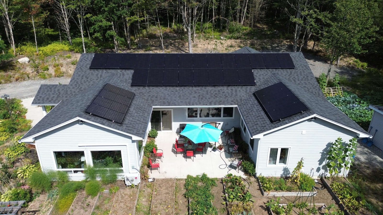 Aerial view of a home in New Brunswick with solar panels on the roof.